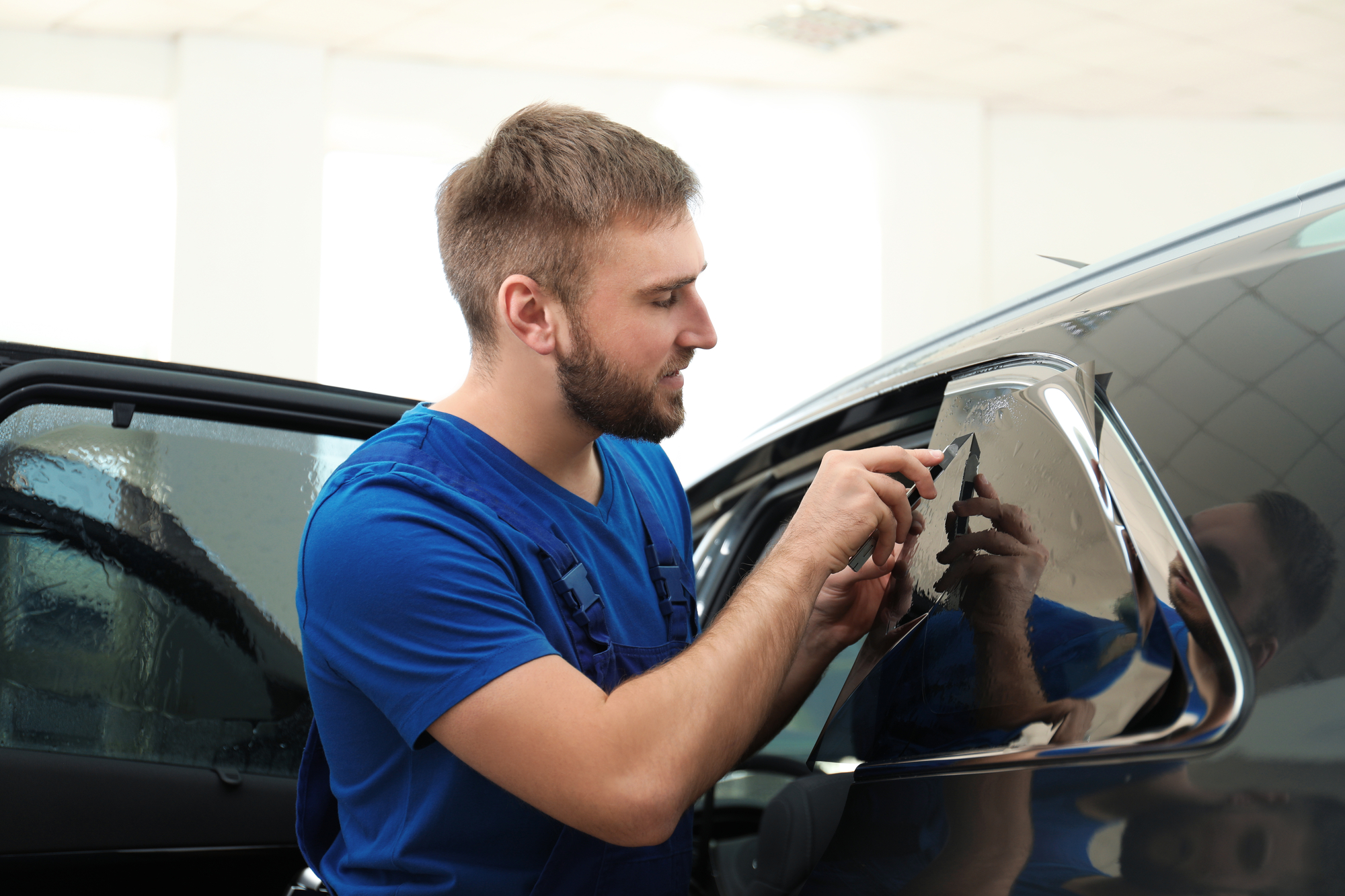 Worker Tinting Car Window